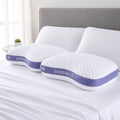 Pair of BEDGEAR Balance Cuddle Curve pillows lying on a bed with breathable, moisture-wicking covers.