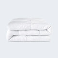 Folded SleepTone Goto Down Alternative Comforter in white, providing hypoallergenic, all-season warmth.
