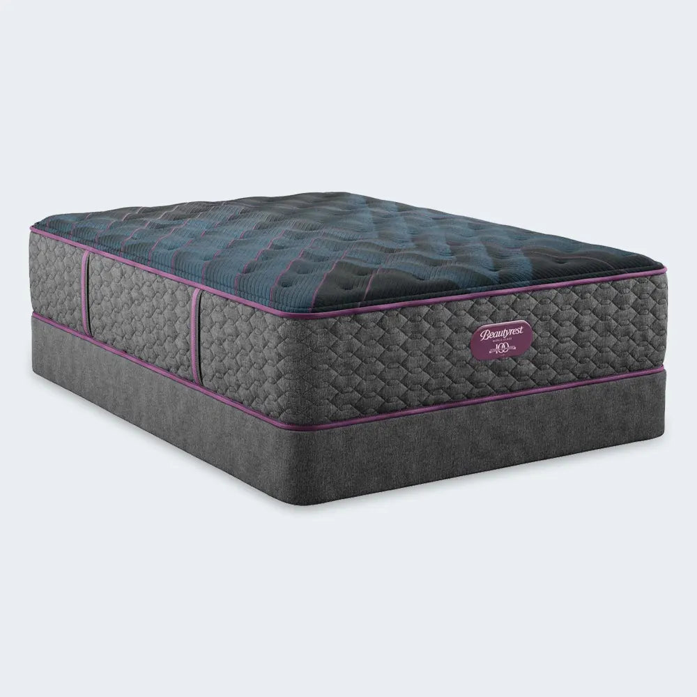 Beautyrest World Class Hybrid Level 4 Plush 13.5 Inch Mattress featuring charcoal quilting and purple accent trim.
