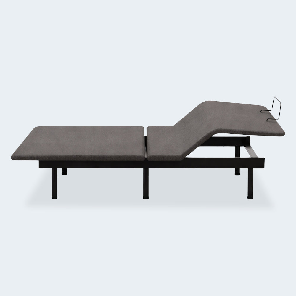 Side profile of the Ashley Comfort Classic wireless adjustable bed frame with the head section elevated for reading or anti-snore relief.
