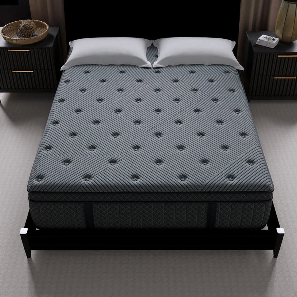 High-angle view of the Allureluxe Classic Bamboo Hybrid mattress top surface with decorative geometric tufting for a plush feel.
