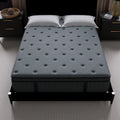 High-angle view of the Allureluxe Classic Bamboo Hybrid mattress top surface with decorative geometric tufting for a plush feel.
