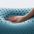 Hand pressing into responsive Malouf ActiveDough foam, highlighting its plush and supportive memory foam feel.
