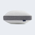 High-loft Sleeptone cooling pillow side view showing the ventilated gray mesh band for airflow.
