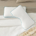 Malouf FlexFill cooling pillows in standard and ergonomic shoulder cutout designs for side sleeper support.
