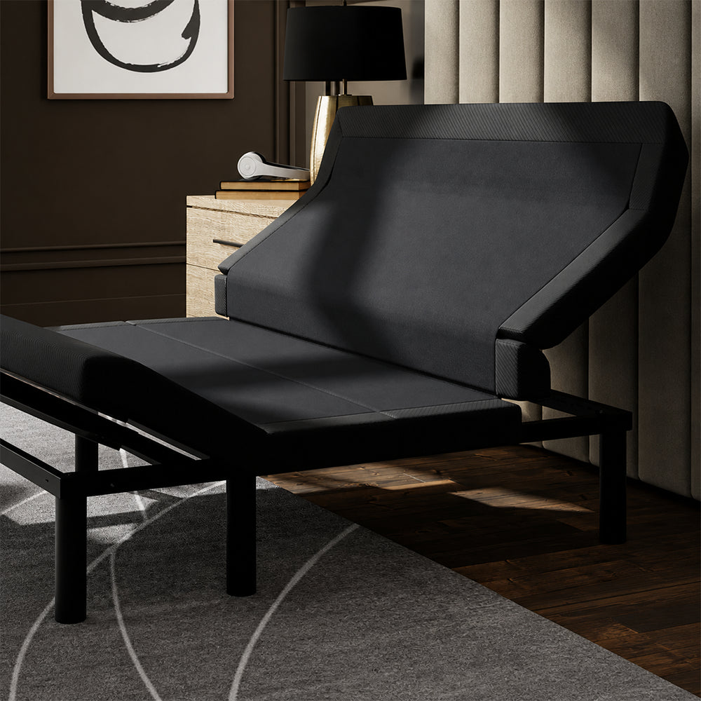 Close-up view of the SBKDL2 adjustable base head section with pillow tilt elevation, showcasing the sturdy motorized construction and sleek fabric finish.
