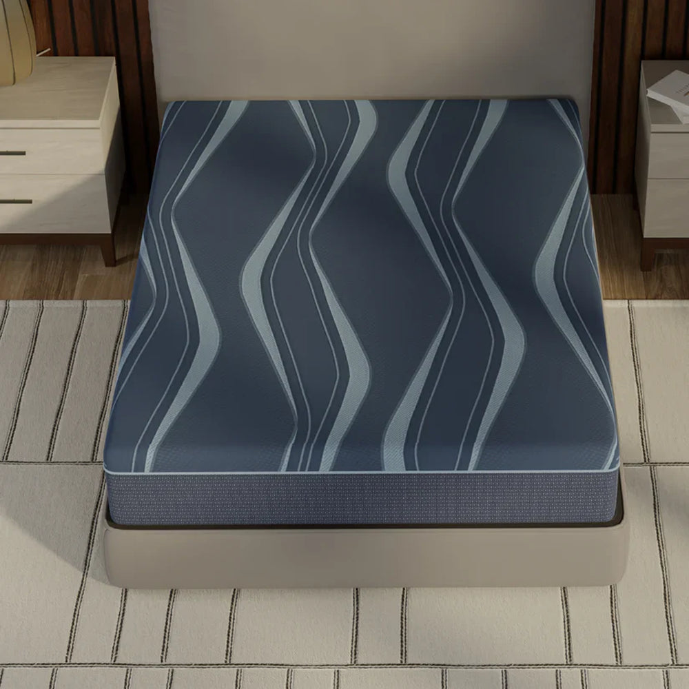 Top-down lifestyle view of the ActiveAlign zoned memory foam mattress highlighting the wavy patterned recovery-driven sleep surface.
