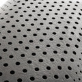 Close-up of Malouf bamboo charcoal infused memory foam showing moisture-wicking and air-circulating holes.
