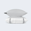 Stacked BEDGEAR pillows in gray Ver-Tex cases highlighting breathable, moisture-wicking cooling fabric.
