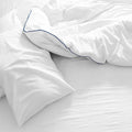 Plush white SleepTone Tranquility comforter with duck down and feather fill for breathable warmth.
