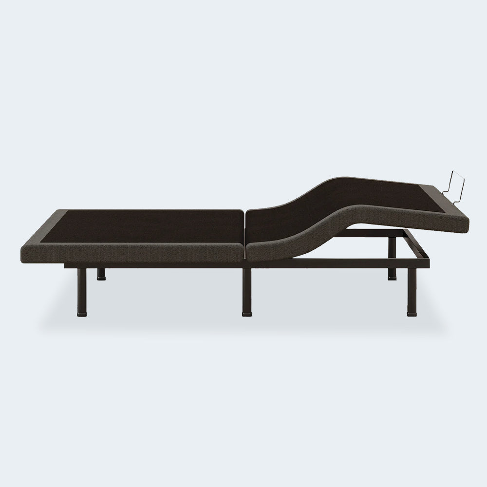 Side profile of the Comfort Premier Steel Adjustable Bed Base by Ashley showing independent head elevation for reading or anti-snore relief.
