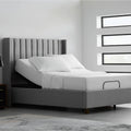 Single Malouf E255 adjustable bed base with a mattress shown in a head-up position within a contemporary bedroom setting.
