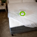 GhostBed mattress protector featuring a secure elastic skirt for a non-slip, deep pocket fit.
