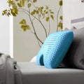Side view of the Malouf shoulder cutout pillow on a bed for targeted neck alignment and side sleeper comfort.
