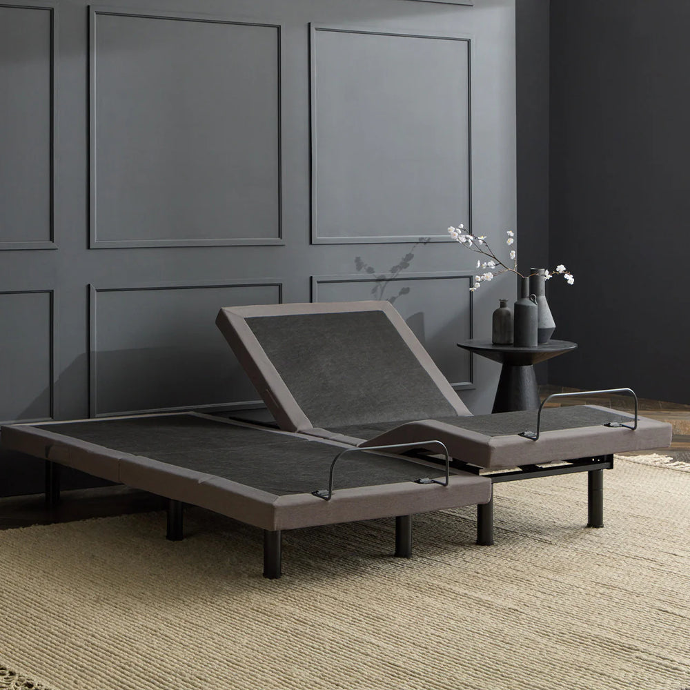 Perspective view of two Malouf S655 Twin XL adjustable bases configured as a split king with independent motorized head elevation.
