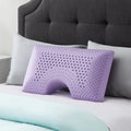 Purple Malouf lavender memory foam pillow with zoned support and ergonomic shoulder cutout for neck relief.