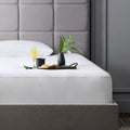 Close-up of the Malouf Prime Mattress Protector providing a snug, noiseless, and breathable fit.

