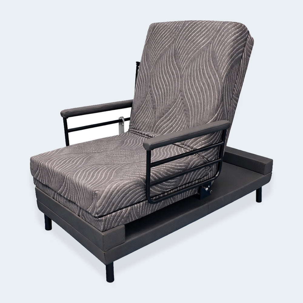 Independence Adjustable Journey Upbed in an upright seated position with sturdy black arm rails for senior safety.
