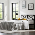 Industrial farmhouse bedroom setup with the Malouf Taylor black metal headboard and cozy neutral bedding.
