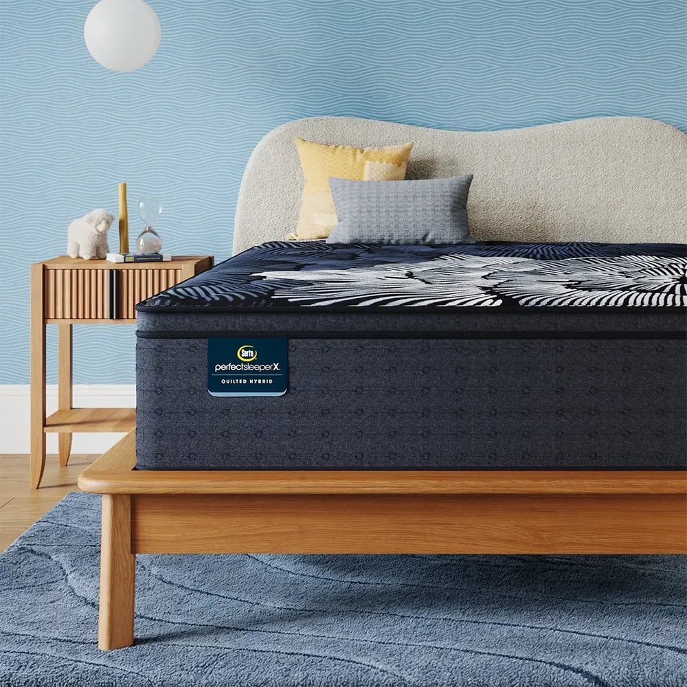 Front view of the high-profile Serta Perfect Sleeper X Max Hybrid Mattress on a wood platform bed frame.
