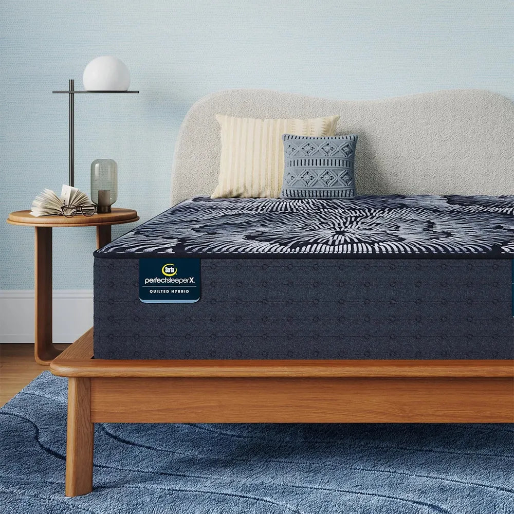 Front view of the Serta Perfect Sleeper X Excelled Extra Firm mattress with cooling and support labels.
