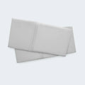 Set of two folded light gray Hyper-Wool pillowcases by BEDGEAR for soft, all-season bedding comfort.
