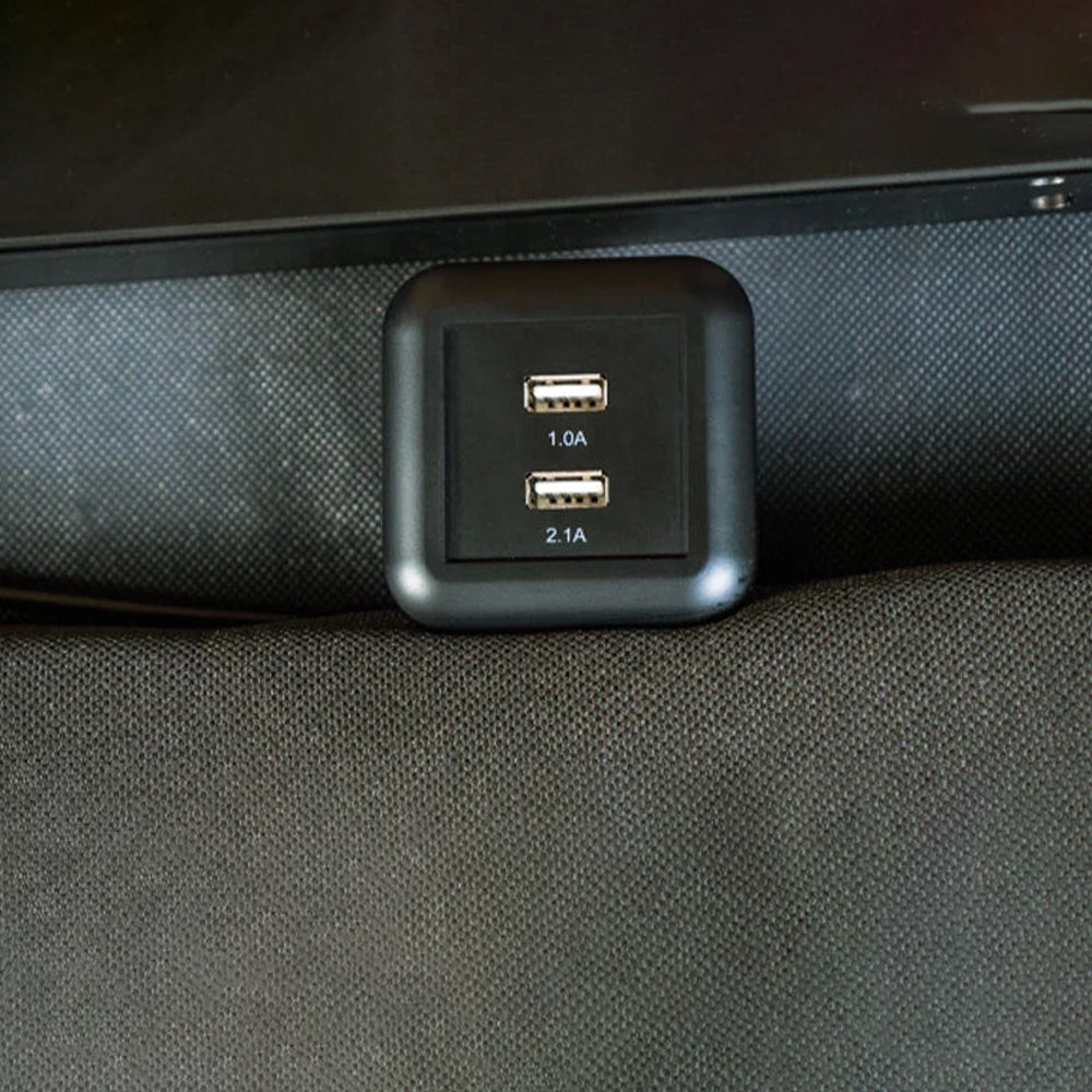 Close-up of the built-in dual USB charging ports (1.0A and 2.1A) on the GhostBed Adjustable Base for convenient device charging.
