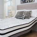 Close-up of the Ashley Chime 10 inch hybrid mattress showing its soft knit quilt cover and durable design.
