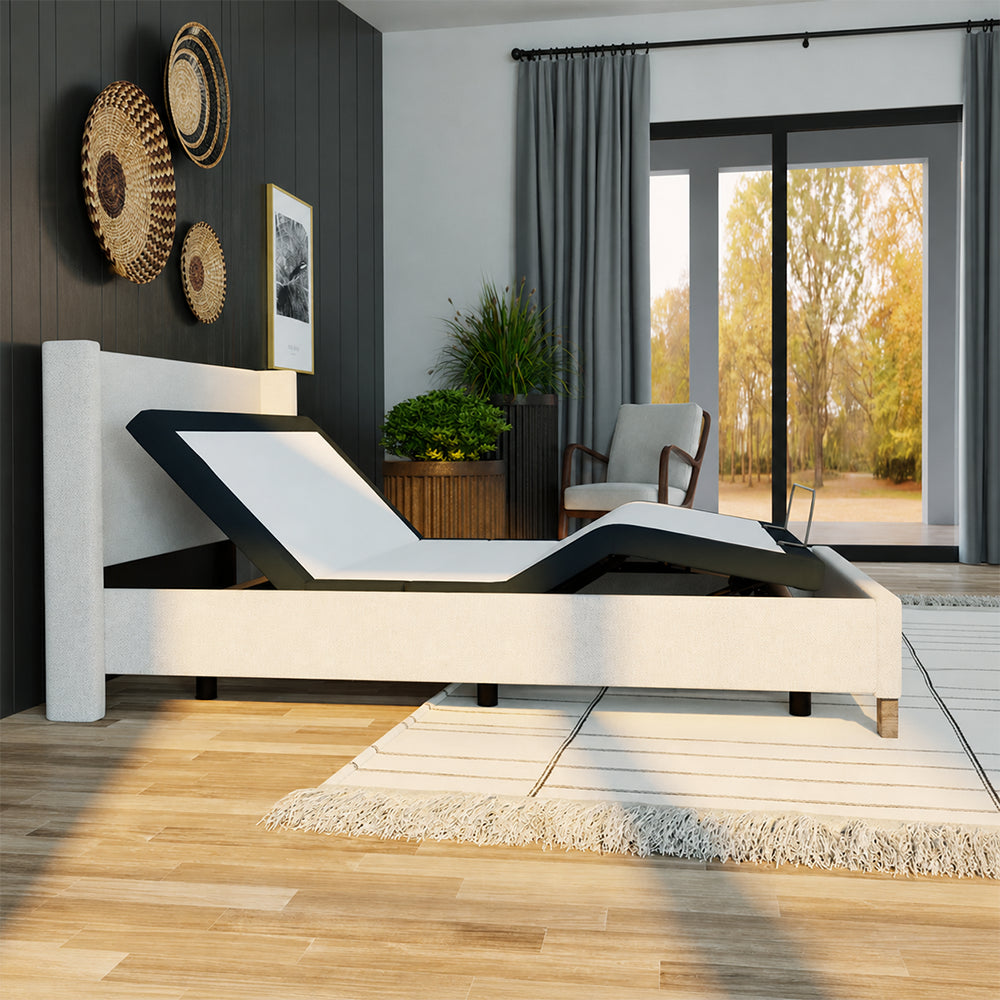 Side profile of the SBKD3 adjustable bed base showing maximum head and foot articulation in a contemporary bedroom setting.
