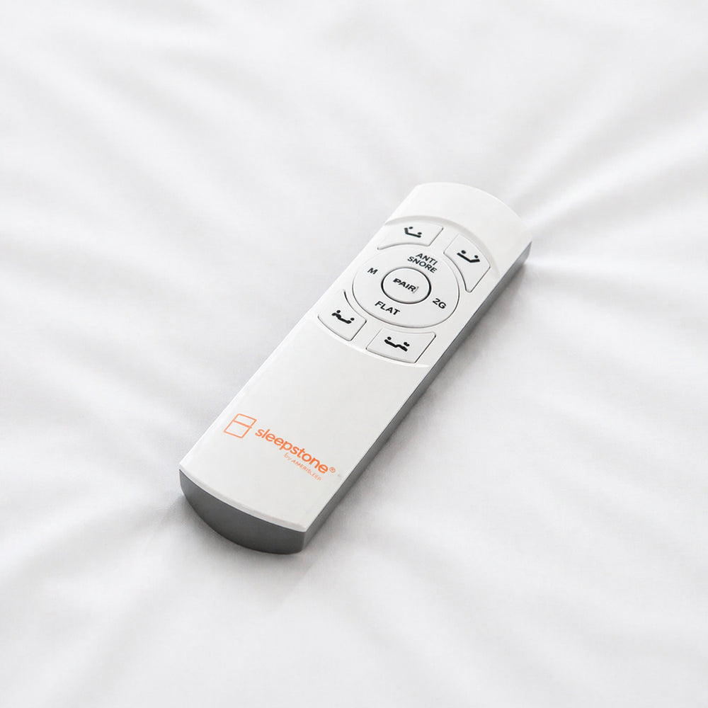 Close-up of the Sleepstone wireless remote control for the S1000 adjustable base featuring dedicated buttons for Zero Gravity, Anti-Snore, and Flat positions.

