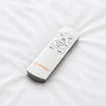 Close-up of the Sleepstone wireless remote control for the S1000 adjustable base featuring dedicated buttons for Zero Gravity, Anti-Snore, and Flat positions.
