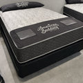 American Bedding Baird 14-inch flippable hybrid mattress on display, showcasing the premium build and two-sided comfort technology.
