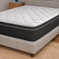 American Bedding Griffin 14" Hybrid Medium Plush Mattress styled in a modern bedroom on a grey upholstered platform bed frame with contemporary decor.
