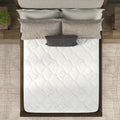 Top-down overhead view of the American Bedding Classic 8 Inch Innerspring Mattress on a wooden frame with neutral bedding.
