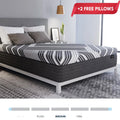Dreamstage Hybrid Mattress in bedroom setting featuring a modern striped cover on a white platform bed frame.
