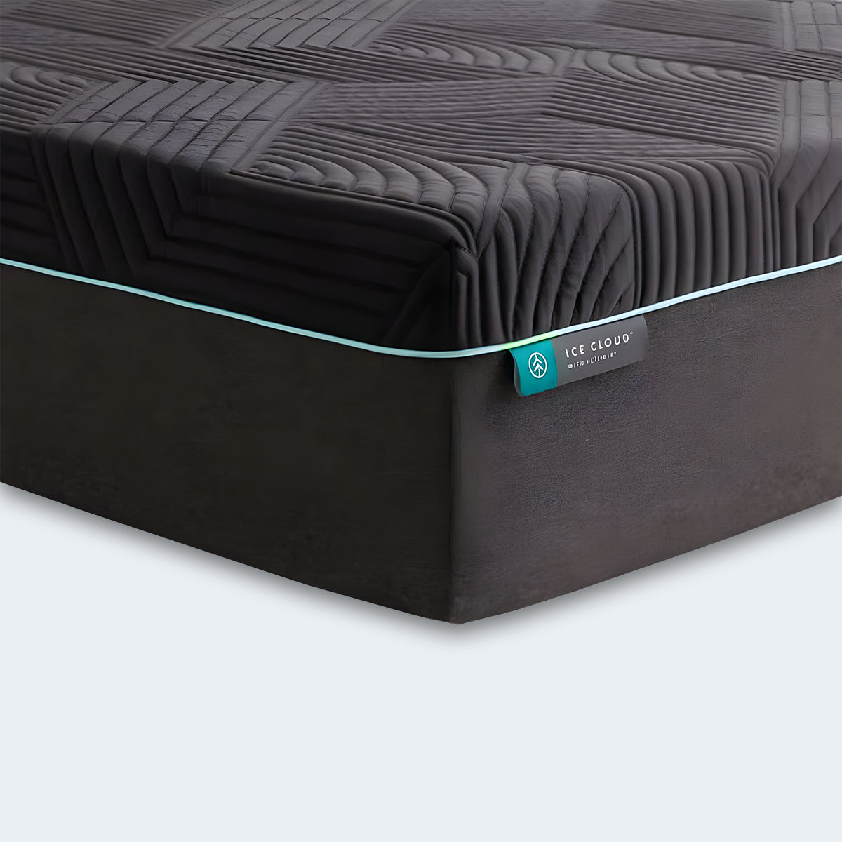 Close-up corner of the Ice Cloud Coolsync Hybrid Mattress showing a textured dark cover and teal piping.