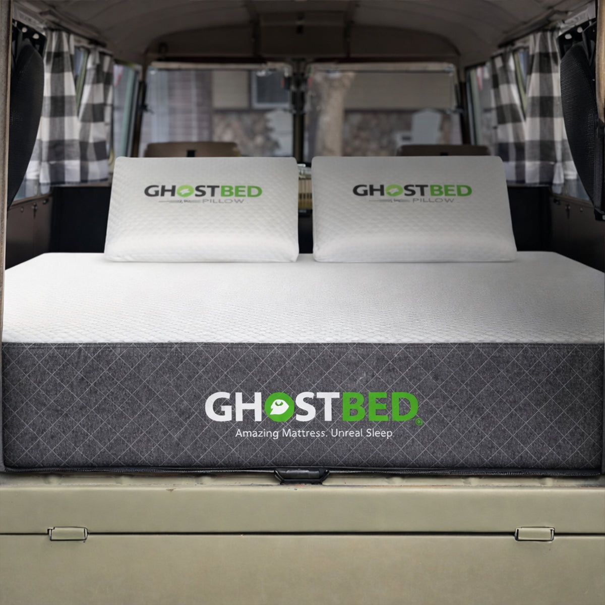 Rear view of the RV 10" Foam Mattress inside a van featuring branded GhostPillows for a complete sleep setup.