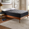 Luxury master bedroom styled with a Corsicana Nights Bridge 12-inch plush mattress on a mid-century modern wooden bed frame.
