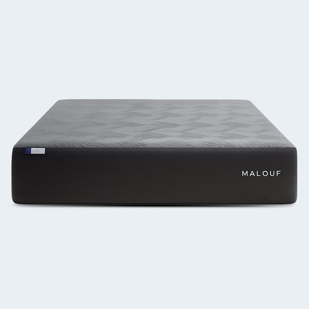 Front-facing view of the isolated Malouf Neve mattress highlighting its sleek 12-inch profile and embroidered Malouf brand logo.

