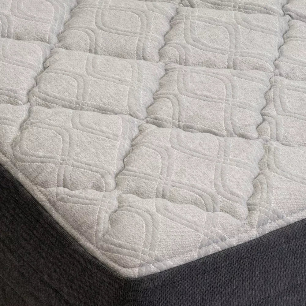 Macro detail of the GhostBed cooling mattress cover showcasing the breathable diamond-quilted fabric for a medium-soft feel.
