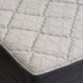 Macro detail of the GhostBed cooling mattress cover showcasing the breathable diamond-quilted fabric for a medium-soft feel.
