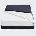 University Bed 8-inch vinyl-free mattress protector by Malouf showing secure fit on a white foam mattress.
