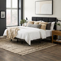 Fully dressed bed with white bedding and a charcoal headboard featuring the hidden Malouf M455 adjustable base system.