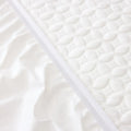 Close-up of the quilted HyperChill cooling fabric and durable elastic skirt on a Malouf protector.