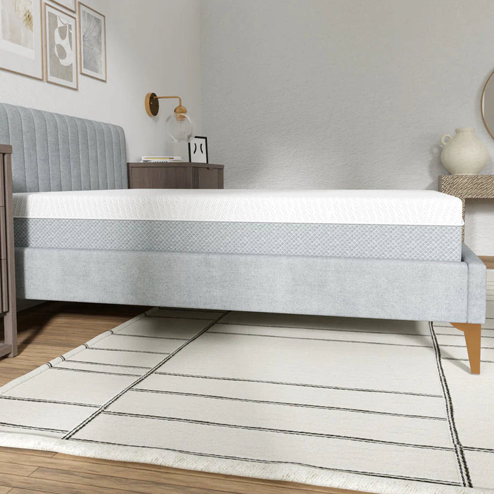 Full side profile of the 10-inch South Bay EcoCore Hybrid mattress highlighting its thick comfort layers and sleek grey borders.