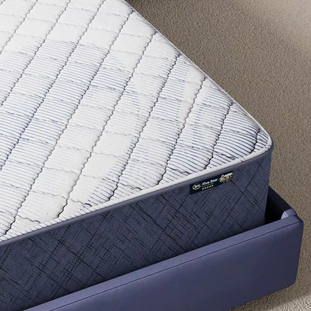 Close-up of the Serta Perfect Day mattress border and logo, highlighting the durable firm construction.
