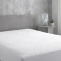 SleepTone SmartGuard 5-sided mattress protector on a bed for total protection against liquids and allergens.
