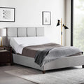 Fully made bed featuring the Malouf M555 adjustable base in a head-up position for comfortable reading or anti-snore relief.
