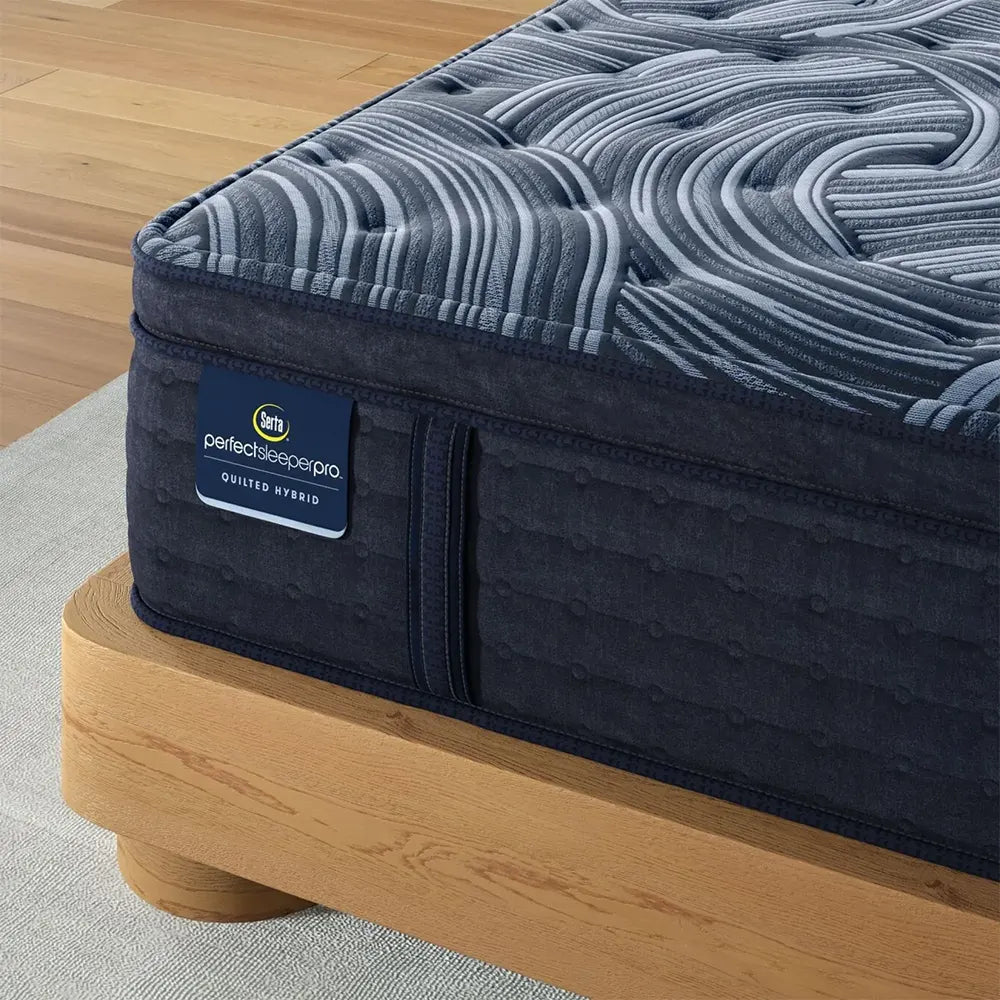 Detailed texture of Serta Perfect Sleeper Pro quilted hybrid mattress with supportive plush pillow top.
