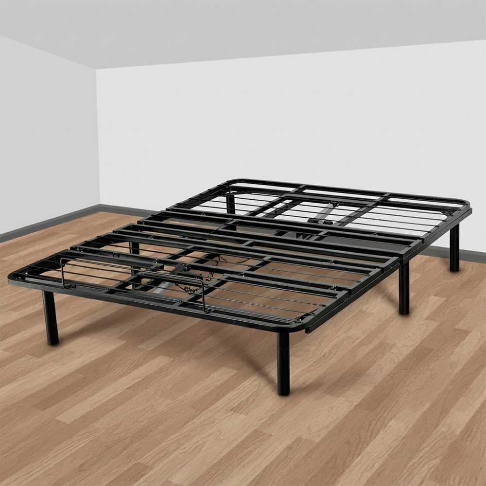 Studio shot of the Goto G50 black steel adjustable bed frame on a wooden floor, designed for easy assembly and durability.
